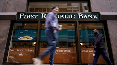 Pedestrians walk past the headquarters of First Republic Bank in San Francisco, May 1, 2023.