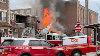 Emergency personnel work at the site of a deadly explosion at a chocolate factory in West Reading, Pa., March 25, 2023.