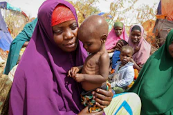 Nunay Mohamed, 25, holds her one-year old child at a makeshift camp outside Mogadishu, Somalia, June 30, 2022.