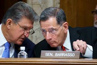 Sens. Joe Manchin, D-W.Va., and John Barrasso, R-Wyo., at the Capitol in Washington, June 23, 2021.