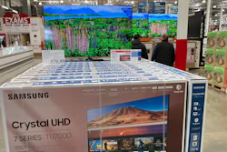 A display of big-screen televisions in a Costco warehouse, April 26, 2023, Sheridan, Colo.