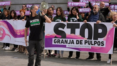 Animal rights activists gather to protest outside Spain's Agriculture Ministry in Madrid, May 21, 2023.