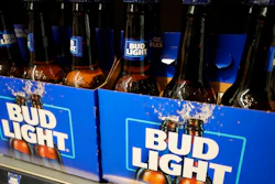 Bottles of Bud Light beer sit on a shelf at a grocery store on April 25, 2023, in Glenview, Ill. Bud Light's parent company said Thursday, May 4, that it will triple its marketing spending in the U.S. this summer as it tries to boost sales.