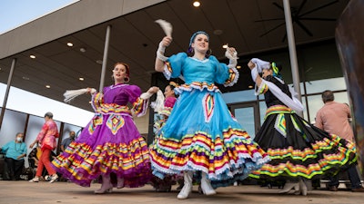 Young Folklorico dancers from the group Viva Mexico begin their dance routine at a Cinco de Mayo celebration hosted by the Odessa Hispanic Chamber of Commerce at the Odessa Marriott Hotel and Convention Center, Wednesday, May 5, 2021, in Odessa, Texas. American bars and restaurants gear up every year for Cinco de Mayo, offering special deals on Mexican food and alcoholic drinks for the May 5 holiday that is barely celebrated south of the border.