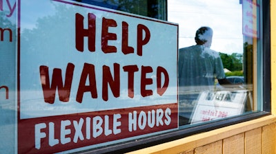 A help wanted sign is displayed in Deerfield, Ill., on Wednesday, Sept. 21, 2022. On Thursday, the Labor Department reports on the number of people who applied for unemployment benefits last week.
