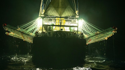 In this July 2021 photo provided by Sea Shepherd, the Chang Tai 802, a Chinese-flagged ship, fishes for squid at night on the high seas off the west coast of South America. During an at-sea encounter, an Indonesian crew member screamed from the stern of the vessel “I want to go home.” The Chang Tai 802 fished for more than a year and finally returned to port in China in August 2022, according to research by the Peruvian fishing consultancy Artisonal. After a brief visit, it returned to South America a month later.