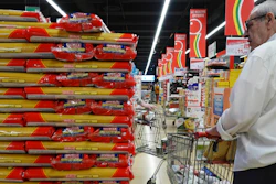 Customers look at packages of pasta in a supermarket in Milan, June 8, 2023.