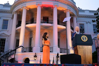 President Joe Biden, with first lady Jill Biden and director Eva Longoria, speaks before a screening of the film 'Flamin' Hot' on the South Lawn of the White House, June 15, 2023.
