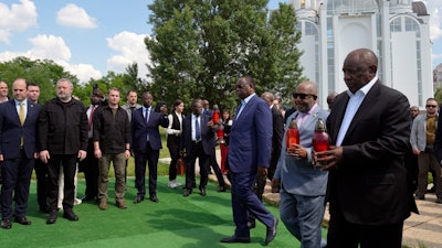 From right, South Africa President Cyril Ramaphosa, President of the Union of Comoros Azali Assoumani and Senegal President Macky Sall attend a ceremony in Bucha, Ukraine, June 16, 2023.
