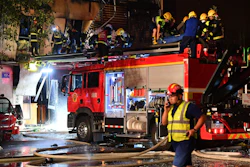 Firefighters work at the site of an explosion at a restaurant in Yinchuan, China, June 21, 2023.