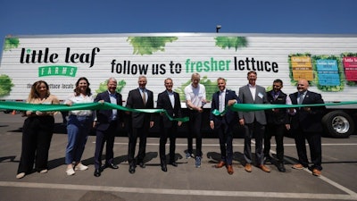 Pennsylvania Gov. Josh Shapiro, center left, and other state officials welcome Little Leaf Farms’ leadership, including founder and CEO Paul Sellew, center right, at a ribbon cutting in McAdoo, Pa.
