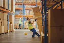 Shot Of A Warehouse Worker Has Work Related Accident He Is Falling Down Before Trying To Pick Up Heavy Cardboard Box From The Shelf Hard Injury At Work 1284193571 1369x770 (1)