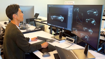 A Toyota Research Institute worker uses a new generative AI technique for vehicle design.