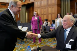 Nicaragua's agent Carlos Jose Arguello Gomez, left, greets Colombia's agent Eduardo Valencia Ospina at the World Court in The Hague, Netherlands, July 13, 2023.