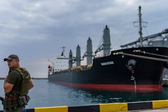 A security officer next to the ship Navi-Star at the Odesa Sea Port, Ukraine, July 29, 2022.