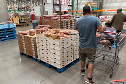 Shoppers peruse Rainer cherries at a Costco warehouse in Sheridan, Colo., July 11, 2023.