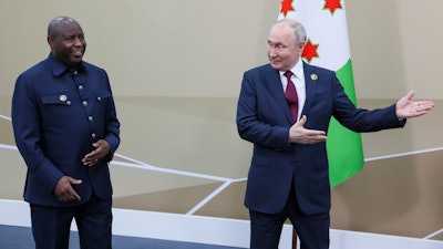 Russian President Vladimir Putin, right, and President of the Republic of Burundi Evariste Ndayishimiye on the sidelines of the Russia Africa Summit in St. Petersburg, Russia, July 27, 2023.