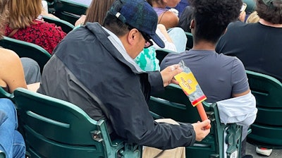 Footage captured by 'New York Nico' of a fan using a hot dog as a straw, Yankee Stadium, New York, Aug. 22, 2022.