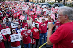 Members of the Culinary Workers Union cheer as Secretary-Treasurer Ted Pappageorge speaks during a rally along the Las Vegas Strip, Aug. 10, 2023.