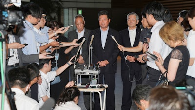 Masanobu Sakamoto, head of the National Federation of Fisheries Cooperative Associations, at a press conference in Tokyo, Aug. 21, 2023.