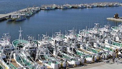 Fishing boats line up at a port in Soma, Fukushima prefecture, Japan Tuesday, Aug. 22, 2023.
