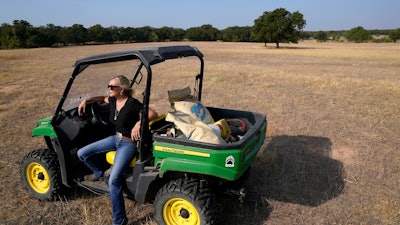 Gilda Jackson on a pasture usually filled with hay on her property in Paradise, Texas, Aug. 21, 2022.
