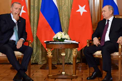 Russian President Vladimir Putin speaks to Turkish President Recep Tayyip Erdogan in Sochi, Russia, Sept. 4, 2023.