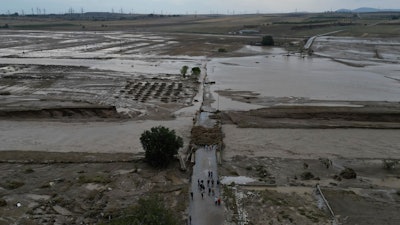 Floodwaters and mud cover land after a record rainstorm, Nea Lefki, Greece, Sept. 6, 2023.