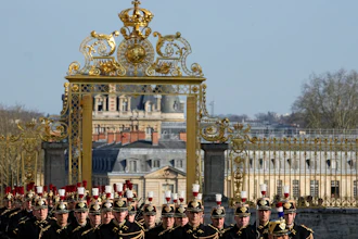 French Republican guards march during an EU summit at the Chateau de Versailles, March 10, 2022.