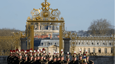 French Republican guards march during an EU summit at the Chateau de Versailles, March 10, 2022.