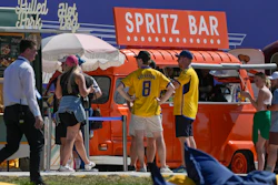 Spectators gather near food trucks at the Marco Simone Golf Club, Guidonia Montecelio, Italy, Sept. 27, 2023.