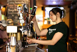 A bartender pours a beer at McMenamin's Tavern in Philadelphia, Thursday, Feb. 9, 2023. Despite having great soft skills, workers with a history of food service work may be overlooked as not having relevant experience when it comes to other careers. These workers, however, often have transferable skills that make for excellent employees, particularly in the fast-paced tech environment.