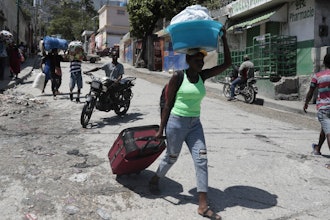 Residents flee their homes to escape clashes between armed gangs in the Carrefour-Feuilles district of Port-au-Prince, Haiti, Aug. 25, 2023.