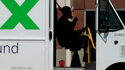 A FedEx driver makes deliveries in Palatine, Ill., Sept. 13, 2023.