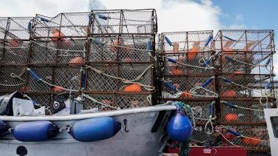 Crab pots sit on a dock in Kodiak, Alaska, June 25, 2023.