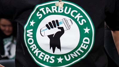 The Starbucks Workers United logo on a shirt at a hearing in Washington, March 29, 2023.
