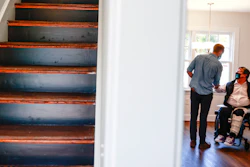 BoundaryLess Living founder and CEO William Sweeney chats with an attendee at a BoundaryLess Living home in Richmond, Va., Nov. 17, 2021.