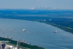 Dredging operations, with the city of New Orleans in the background, in Plaquemines Parish, La., Sept. 26, 2023.