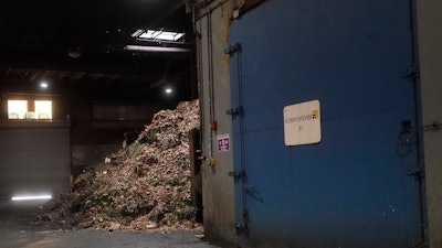 Organic material piled up behind a digester at a GreenWaste Zanker Resource Recovery Facility in San Jose, Calif., Oct. 27, 2023.