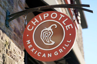The Chipotle Mexican Grill logo hangs outside a restaurant location, Dec. 20, 2022. On Wednesday, Sept. 27, 2023, a federal agency sued the restaurant chain Chipotle, accusing it of religious harassment and retaliation after a manager at a Kansas location forcibly removed an employee's hijab, a headscarf worn by some Muslim women.