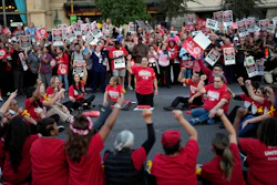Members of the Culinary Workers Union block traffic along the Strip, Oct. 25, 2023, Las Vegas.
