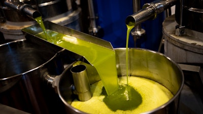 A tank is filled with olive oil at the 'La Betica Aceitera' oil mill, Quesada, Spain, Oct. 27, 2022.