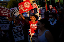 Members of the Culinary Workers Union rally along the Strip in Las Vegas, Oct. 25, 2023.