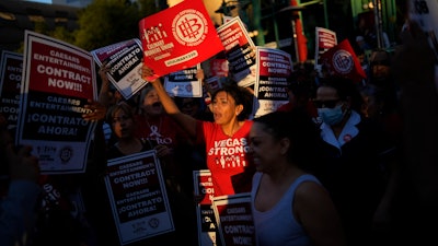Members of the Culinary Workers Union rally along the Strip in Las Vegas, Oct. 25, 2023.
