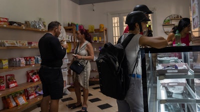 People shop at a private grocery store in Havana, Nov. 11, 2023.