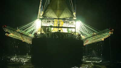 In this July 2021 photo provided by Sea Shepherd, the Chang Tai 802, a Chinese-flagged ship, fishes for squid at night on the high seas off the west coast of South America.