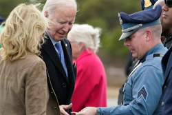 President Joe Biden and first lady Jill Biden greet Massachusetts State Police before boarding Air Force One, Nantucket Memorial Airport, Nantucket, Mass., Nov. 26, 2023.