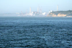 The Fukushima Daiichi nuclear power plant, damaged by a massive March 11, 2011, earthquake and tsunami, is seen from the nearby Ukedo fishing port in Namie town, northeastern Japan, on Aug. 24, 2023.