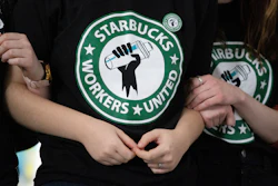 Starbucks employees and supporters react as votes are read during a union-election watch party in Buffalo, N.Y., Dec. 9, 2021.