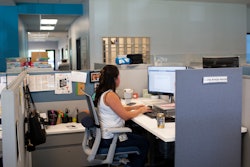 Social worker Lupita Armijo-Garcia at her desk at the Ottawa Co. Dept. of Public Health, Sept. 5, 2023, Holland, Mich.